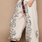 Off White & Black Embroidered Pants