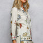 Off White Print Shirt with Cowrie Shell Detail