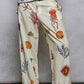 Off White Print Pants with Cowrie Shell Detail