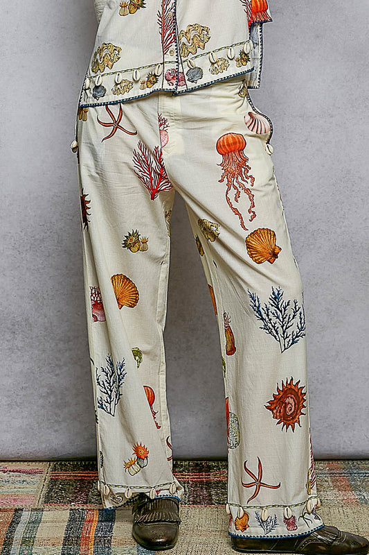Off White Print Pants with Cowrie Shell Detail