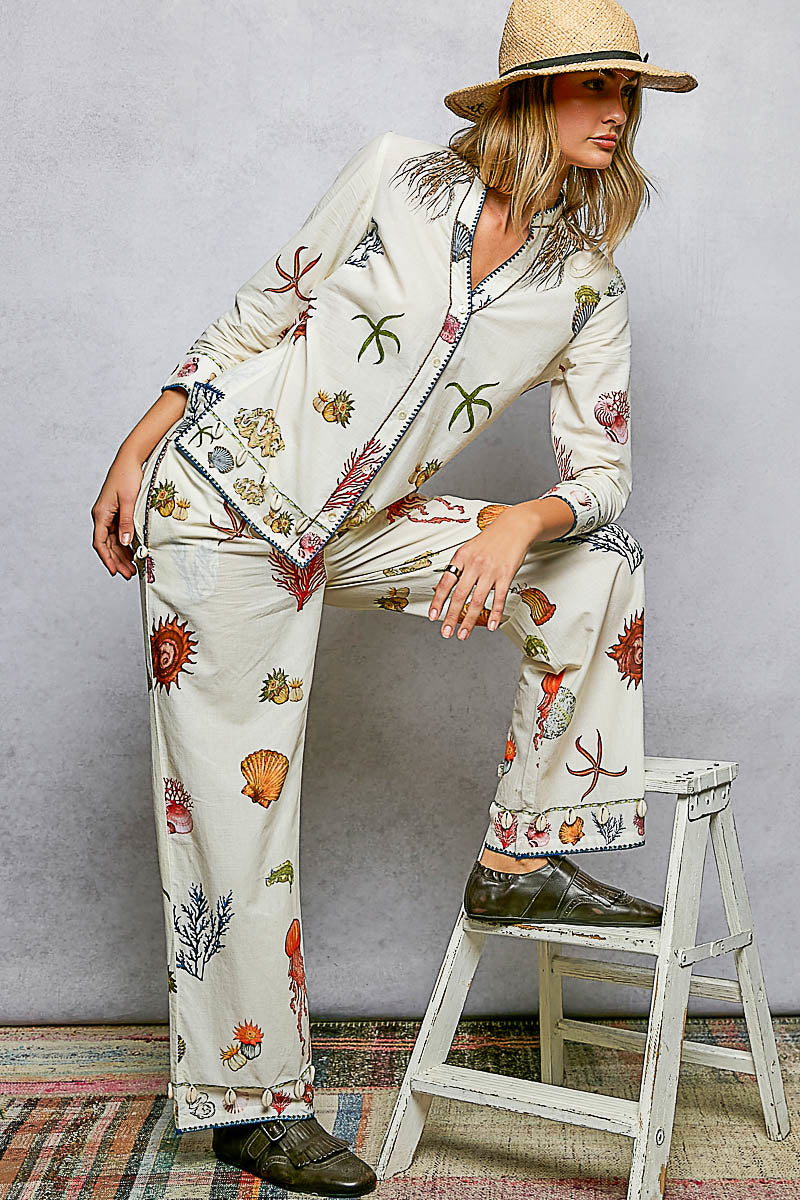 Off White Print Pants with Cowrie Shell Detail