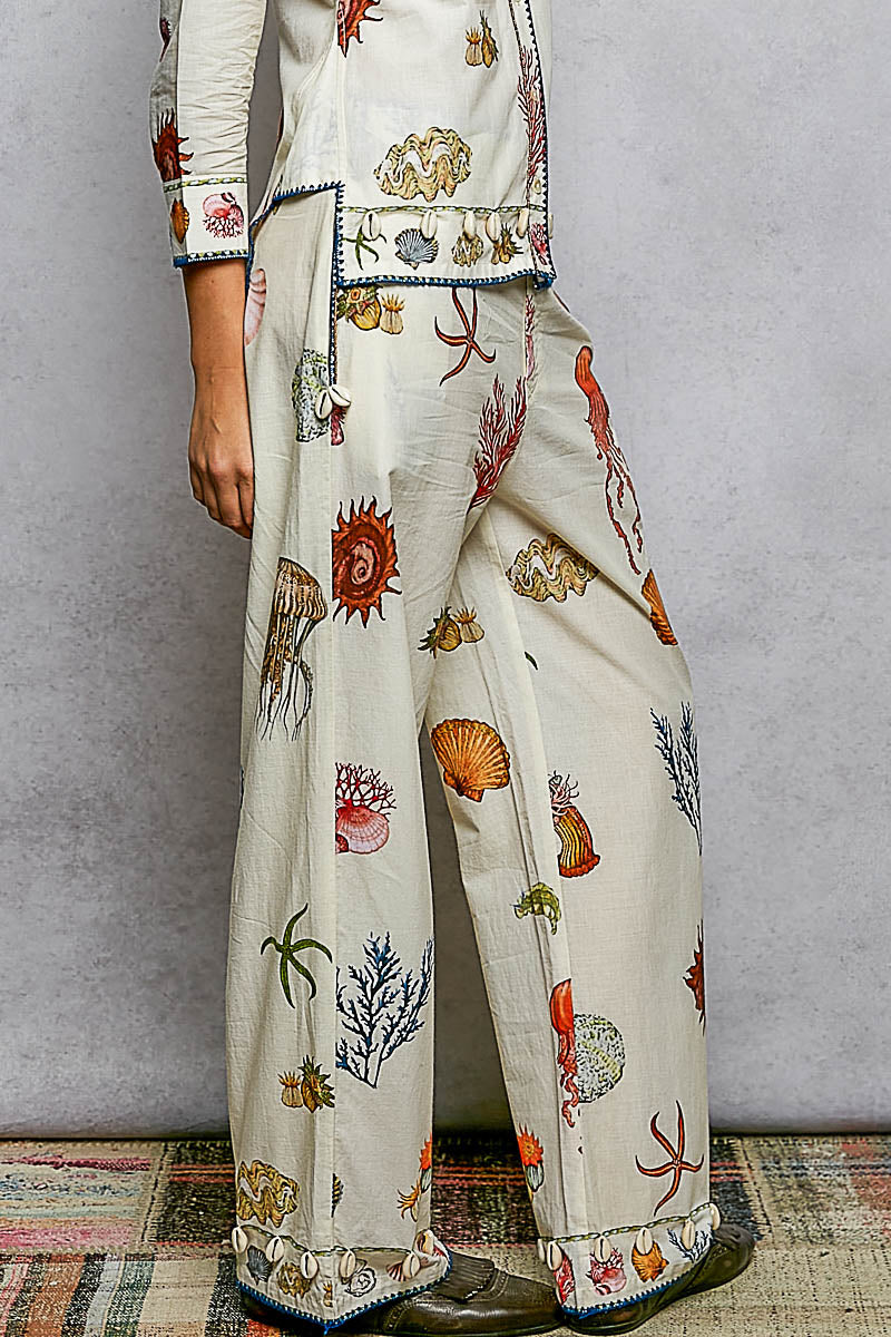 Off White Print Pants with Cowrie Shell Detail