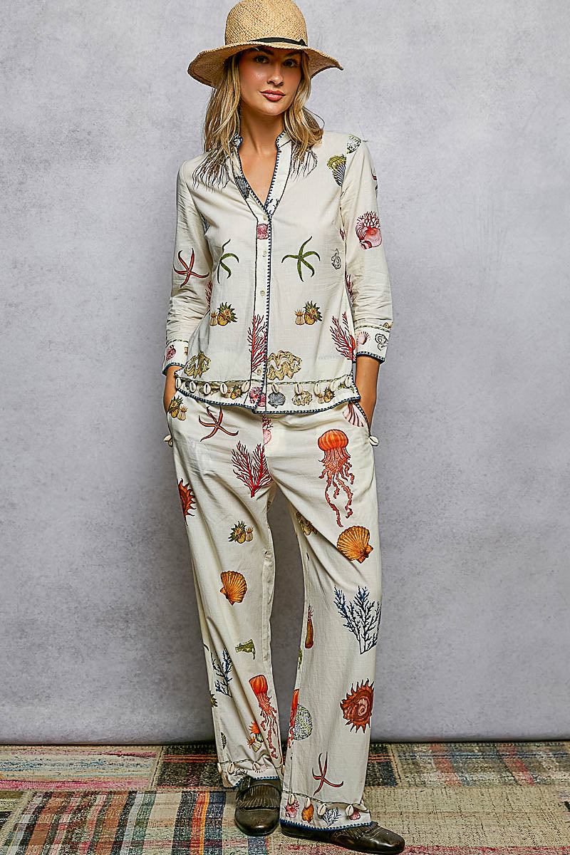 Off White Print Pants with Cowrie Shell Detail