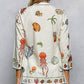 Off White Print Shirt with Cowrie Shell Detail